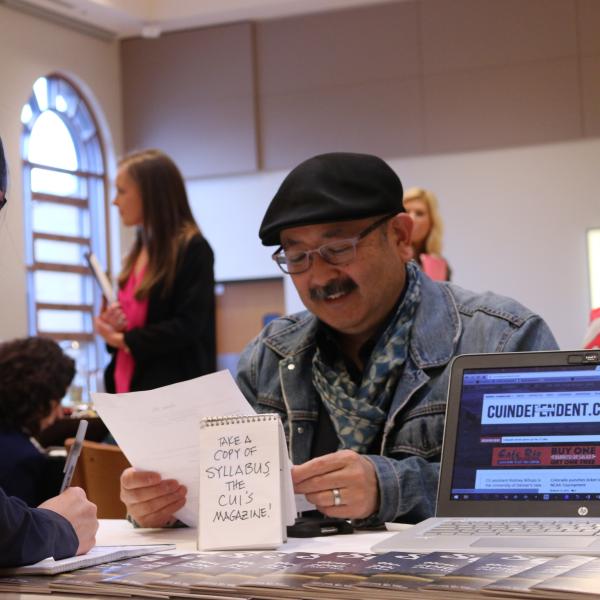 Gil Asakawa promoting the CU Independent at the career fair