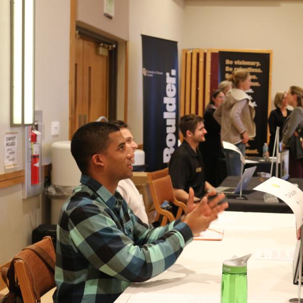 Students talking with a representative at the career fair