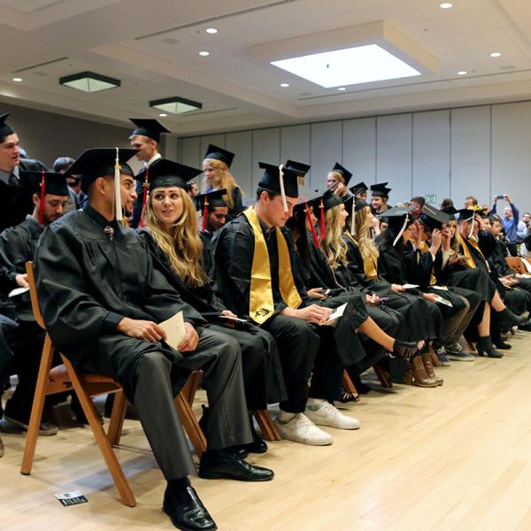 Graduates take their seats.