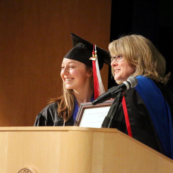 Leala King receives the outstanding graduate award.