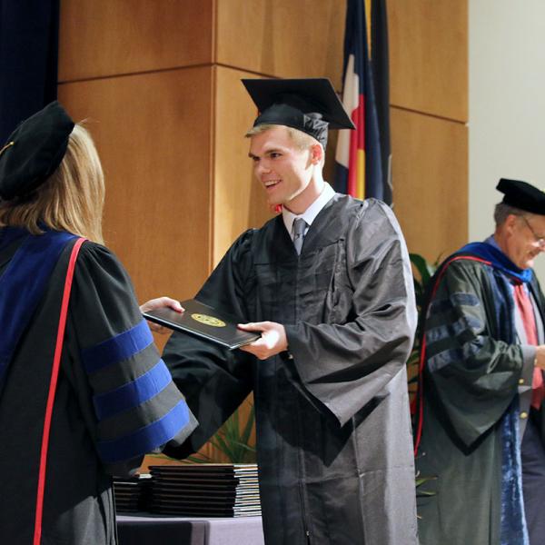 Graduates receive their degrees.