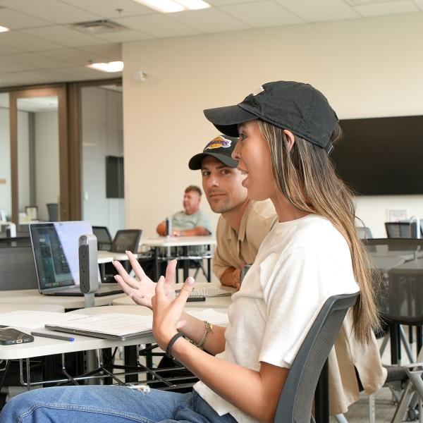 Communication PhD student, Jayne Simpson, coaches Pathways students in their Public Speaking class.