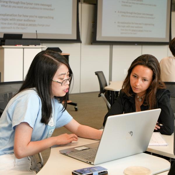 Pathways students Amy Kibort and Sierra Dunham work together in their Public Speaking class.