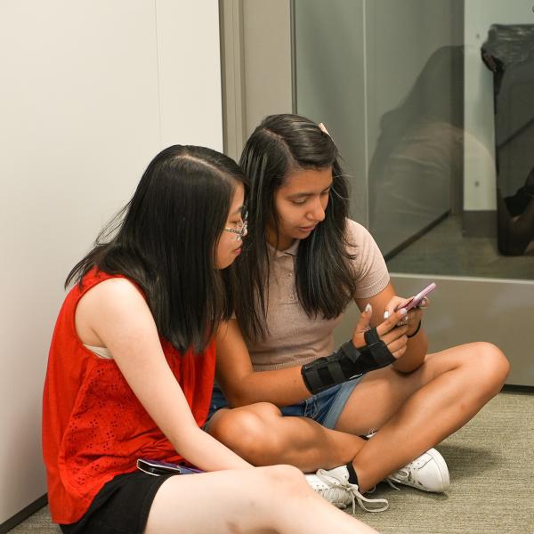 Future CMCI students Juanita Hurtado and Amy Kibort work together to make a TikTok video about their Pathways experience.