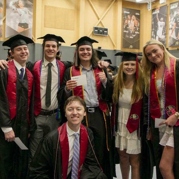Students pose in the practice gym prior to the Recognition Ceremony.