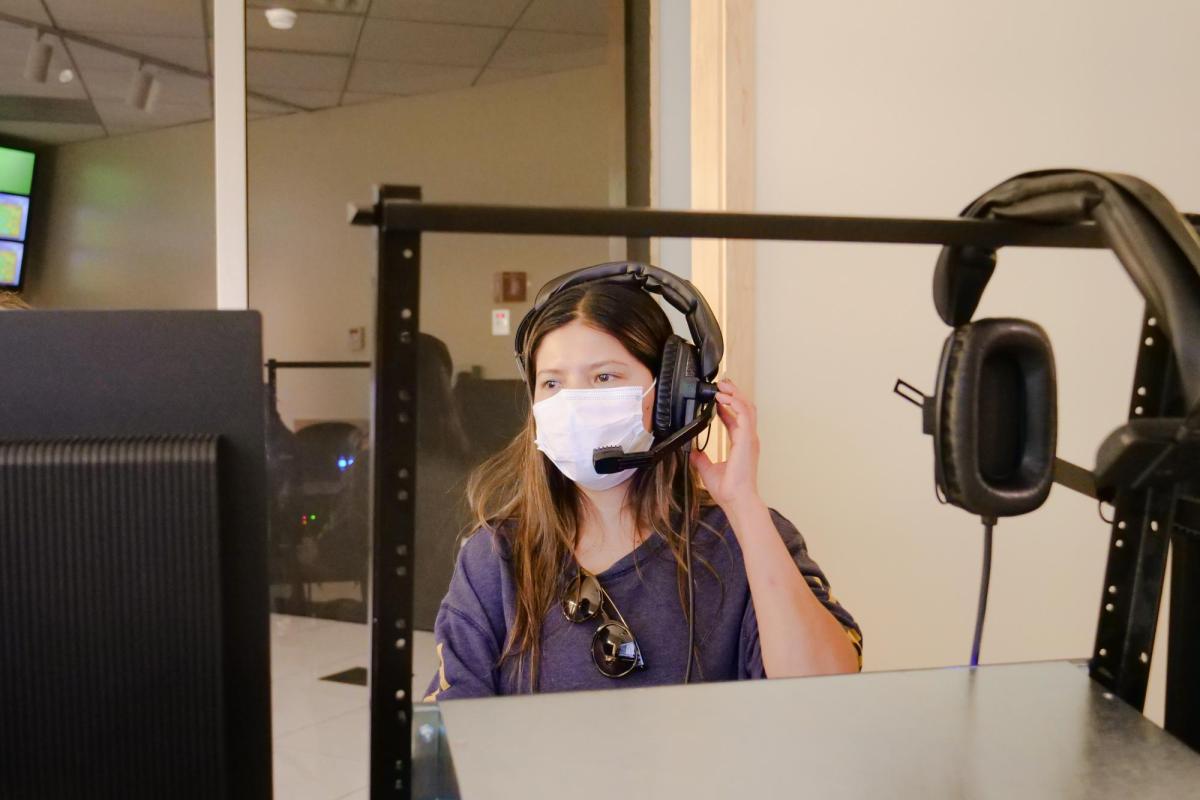 Student behind the scenes in broadcast studio