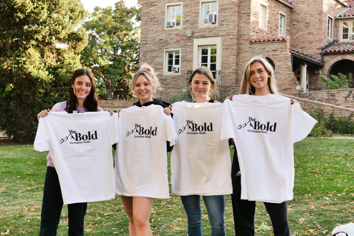 Students pose with The Bold shirts