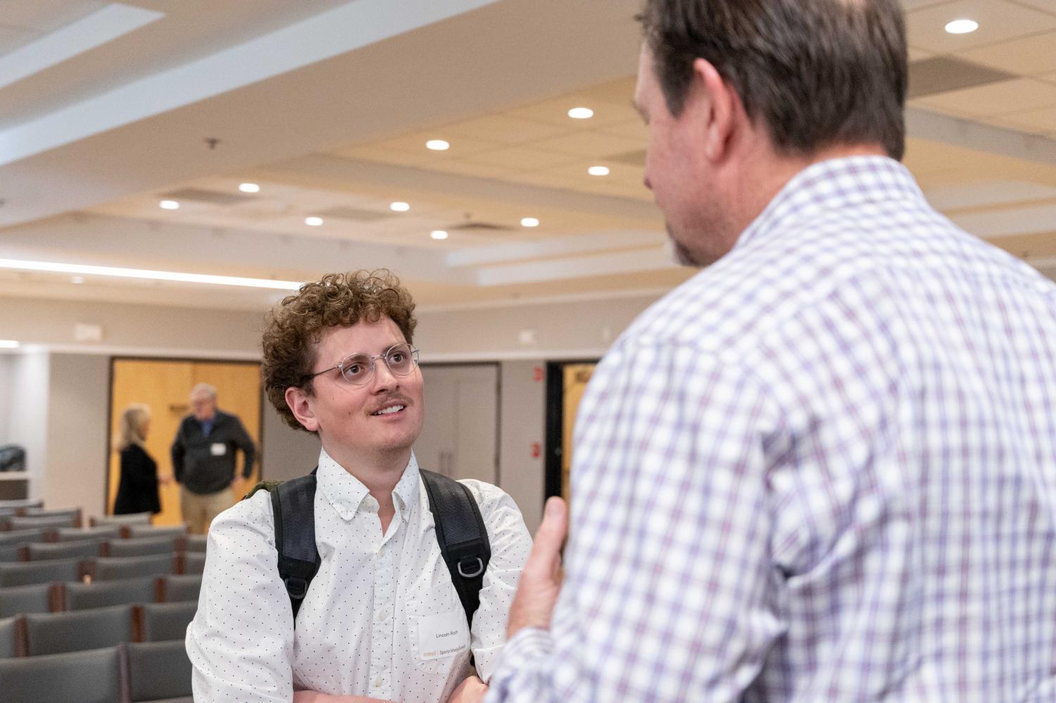 Journalism junior Lincoln Roch networks at CMCI's Sports Media Summit