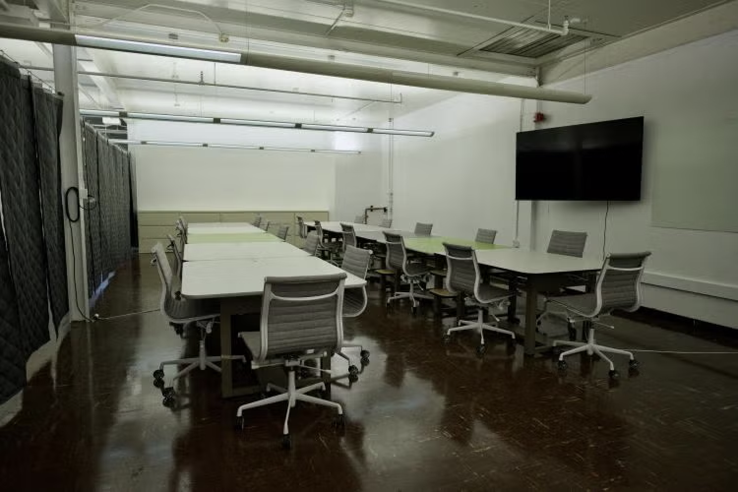 desks and tv in third floor studio