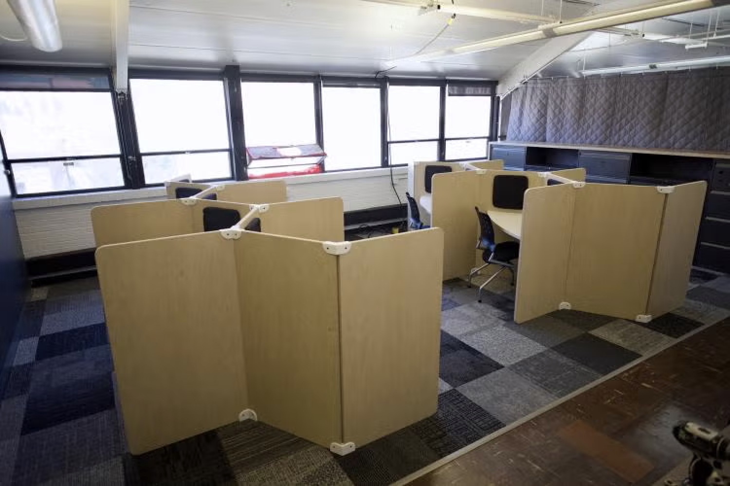 desks and cube areas in third floor studio