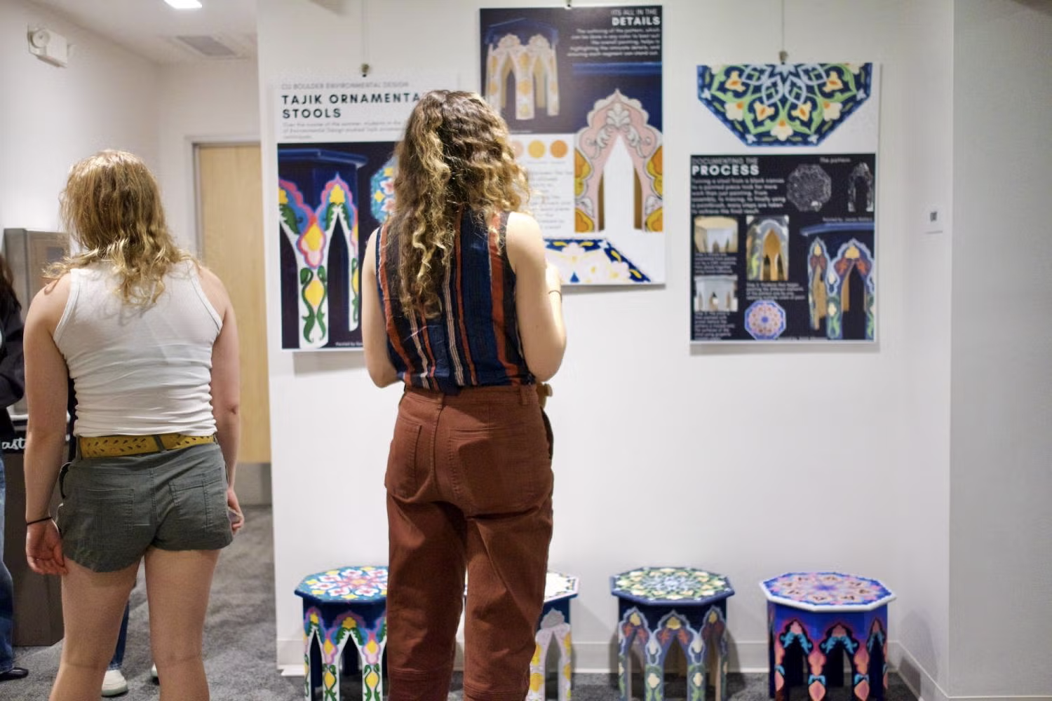 students observing teahouse restoration displays