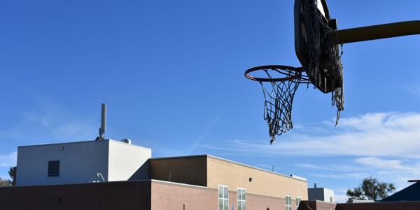 A basketball hoop at Castro Elementary School, in the Westwood neighborhood of Denver. (Jackson Reed, Special to The Colorado Sun)