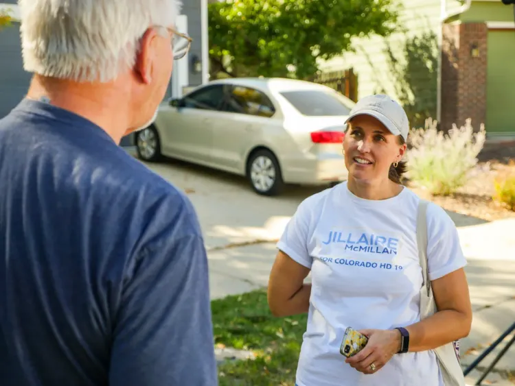 Candidate Jillare McMillian speaking with an undecided voter last fall