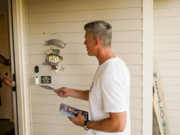 Candidate Dan Woog went door to door on the campaign trail last fall