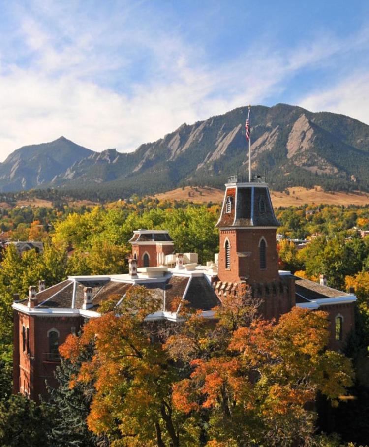 Old Main on the CU campus, with the Flatirons in the distance.