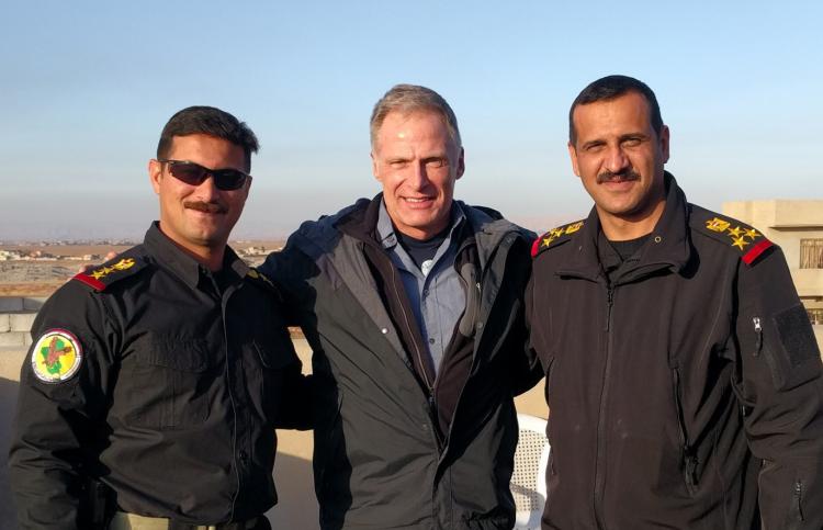 Mitch Utterback with two Iraqi officers