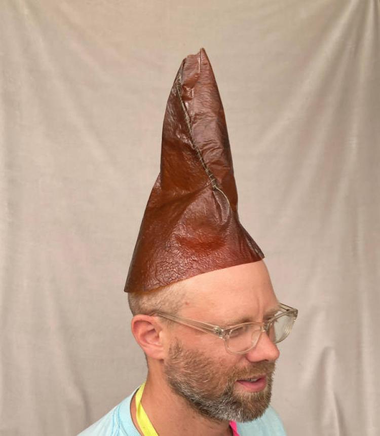 Doug Paulson wearing pointy brown hat