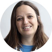 A headshot of Laura Crimaldi against a neutral background.