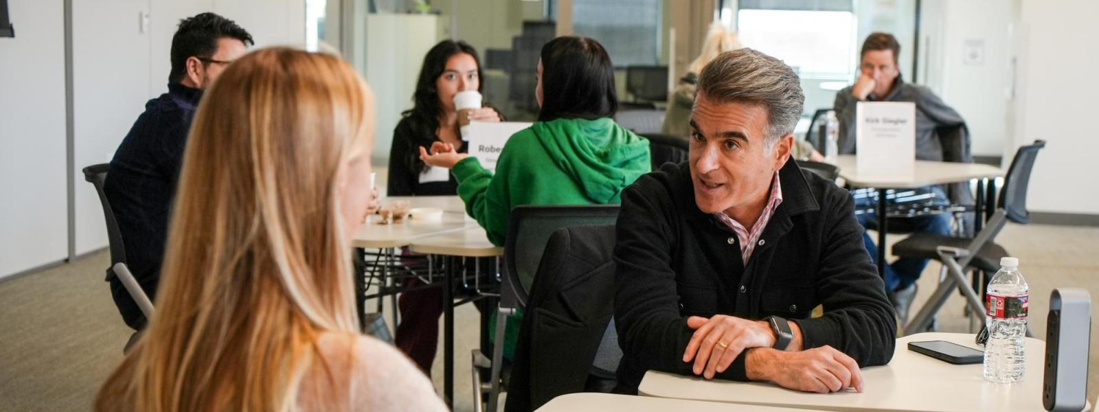 Advisory board member gives advice to students