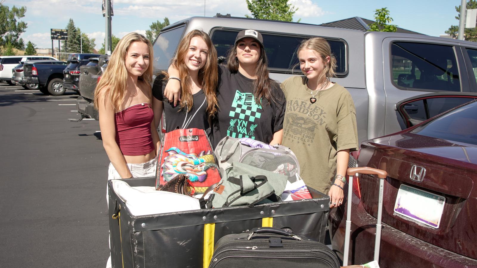 A group of students poses during move-in.