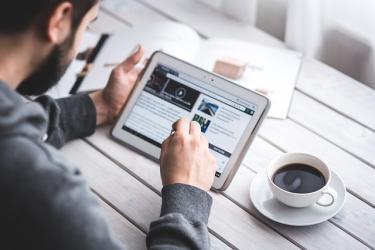 Man studying a blog