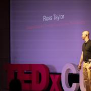 Ross Taylor on stage at a TED Talk