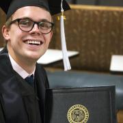 student with diploma