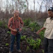 Michael Kodas (left) interviews an Indonesian environmental activist during one of his reporting trips to Sumatra and Borneo in 2014.