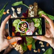 a phone taking pics of food