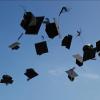 Graduation caps in the air