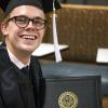 student with diploma
