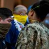 Sailors assigned to the aircraft carrier USS Theodore Roosevelt are checked for body temperature amid the coronavirus pandemic at Naval Base Guam, United States on April 07, 2020. 