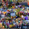 A memorial in Las Vegas, with flowers, balloons, photos and candles, to honor victims of a mass shooting.