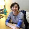 Stephanie Quon sits at her desk in the CMCI Advising Office. Credit: Hannah Prince/CU Boulder