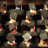 Students sit at winter graduation.