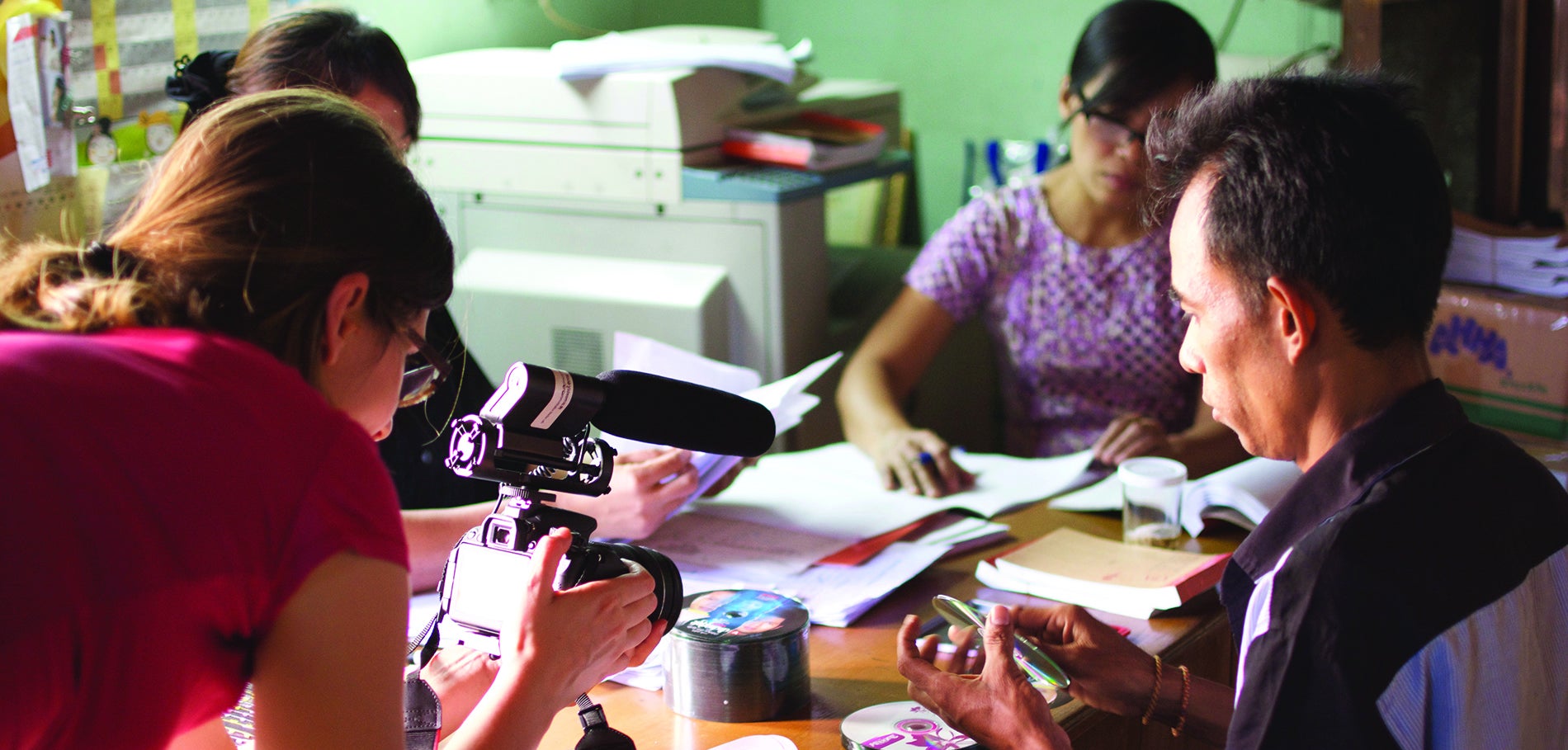 Assistant Professor Sandra Ristovska (far left) films the short documentary Filmmaking for Democracy in Myanmar, for which she was the cinematographer. 