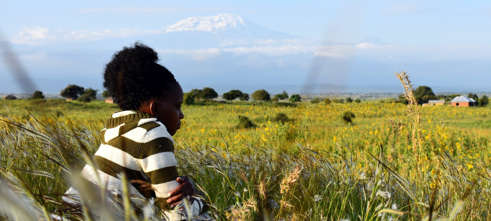 Image of Mollel taken in 2018, showing the close proximity of her village to Mount Kilimanjaro. 