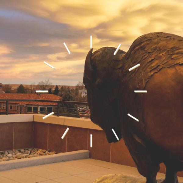 clock illustration over a Ralphie statue