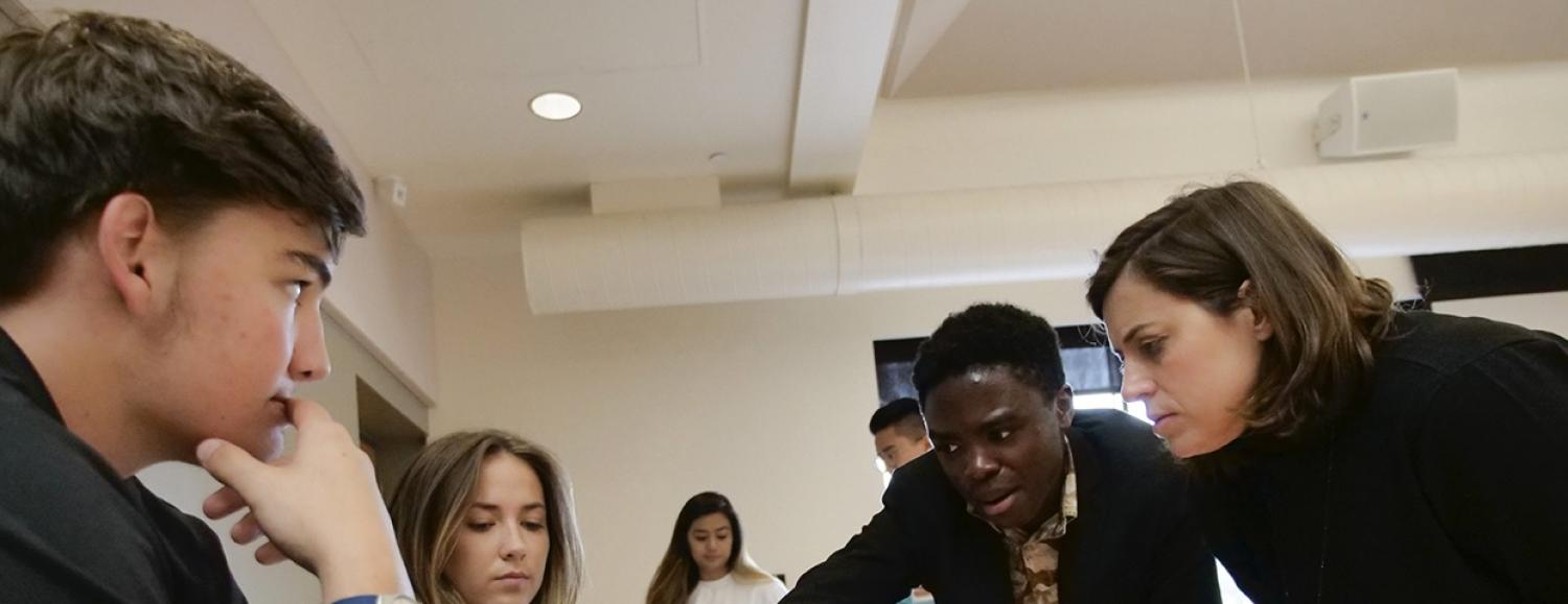 Leysia interacting with others at the info showcase