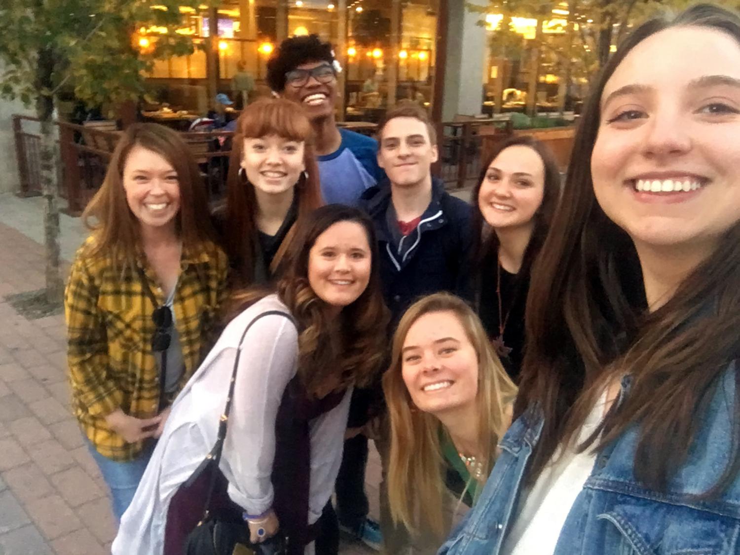 Students pose for a selfie after attending a theatre outing with Willis.