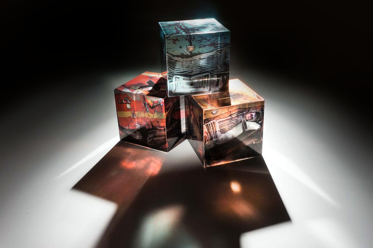Solid glass blocks from Curry’s Untotaled show. Cars were collected, crushed into cubes, and then photographed from all six sides to create the imagery for this “sculptural photography.”