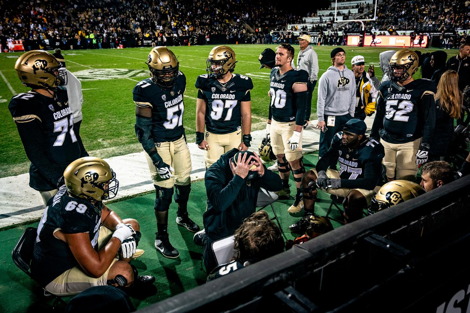 Players and coaches react as the Buffs suffer a late-game collapse against Stanford in October 2023. CMCI students work as photographers and videographers from the sidelines of CU home games. Photo by Nathan Thompson (Jour’24).