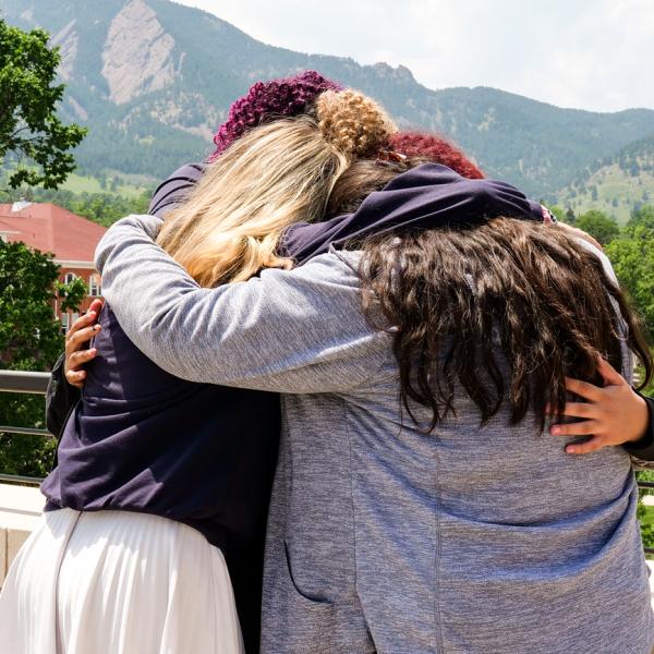 Connections participants exchange goodbye hugs as the program comes to a close.