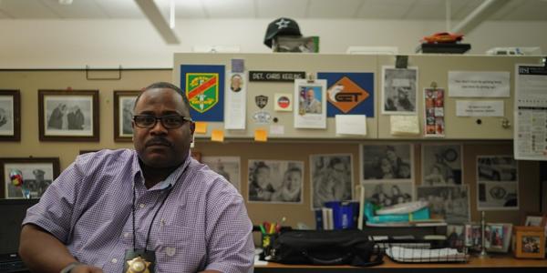 Los Angeles County Sheriff’s Department Hate Crime Coordinator Christopher Keeling speaks with fellows at his office. Photo by News21 fellow Angel Mendoza.