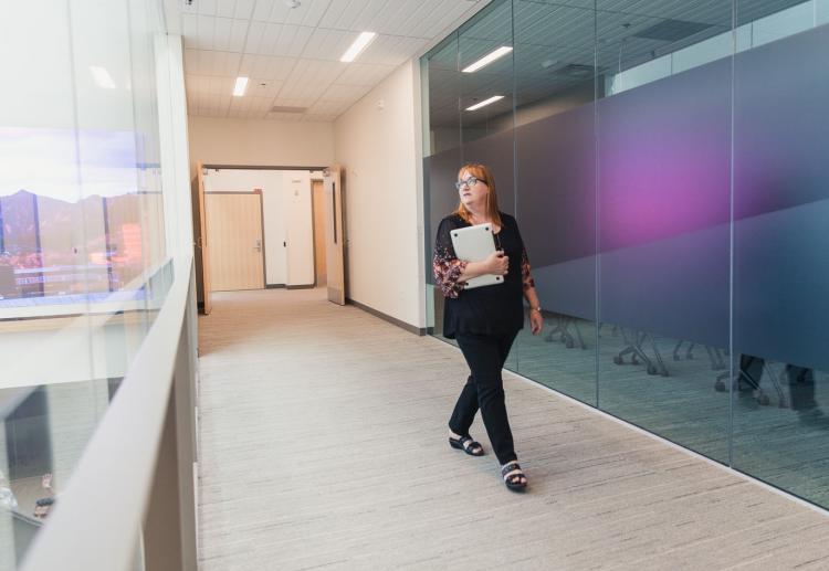 Woman walking down the hall in CASE