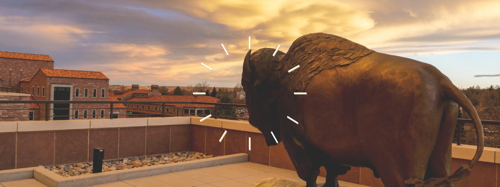 clock illustration over a Ralphie statue