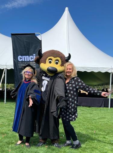 2 women pose with CU mascot Chip