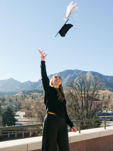 Sophia tosses her graduation cap.