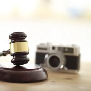 photo of judge's gavel and camera by Sangeun Shin