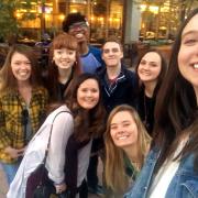 Students pose for a selfie after attending a theatre outing with Willis.